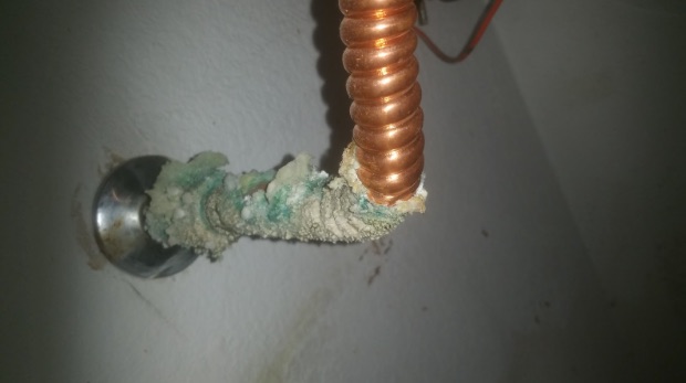 Coiled copper pipe with calcification damage - Robins Plumbing Inc.