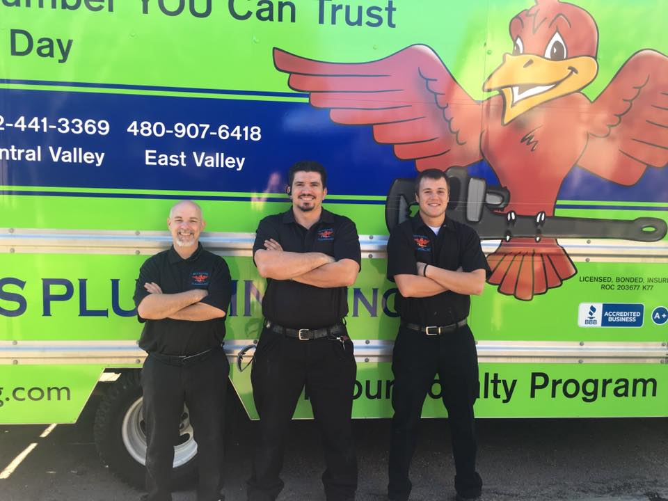 3 plumbing technicians standing in front of green company van for blog "Team Work Drives Customer Service"