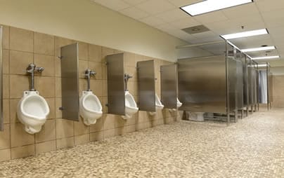 Urinals and stalls in commercial setting for blog "Commercial Emergency Plumbers"