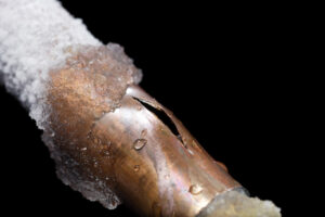 Burst copper pipe with ice/frost on the outside for blog "Winter Plumbing Tips in Phoenix"