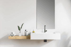 A bathroom sink and vanity mirror.