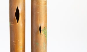 A frozen copper pipe that has burst due to frost