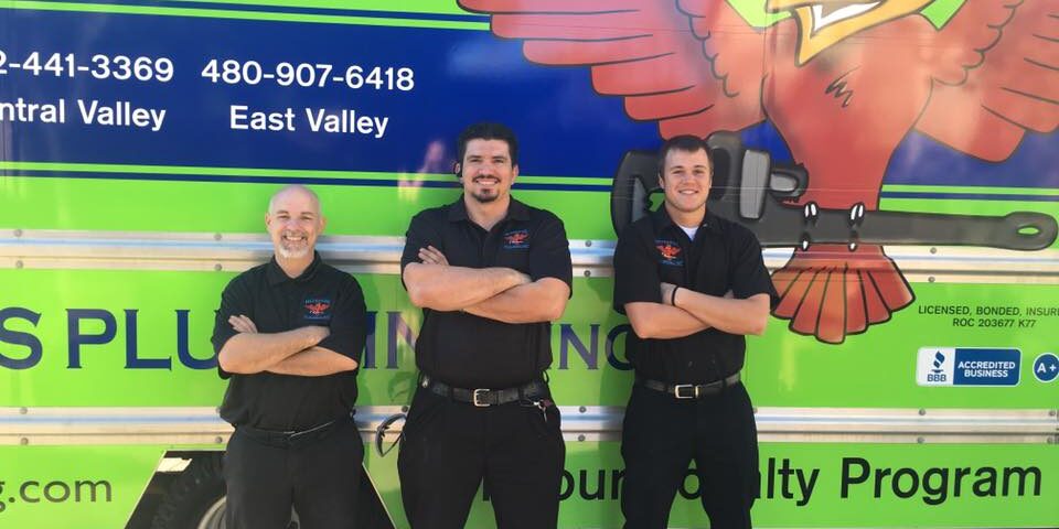 3 plumbing technicians standing in front of green company van for blog "Team Work Drives Customer Service"