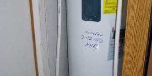 Water heater in small space for blog "Water Heater Dimensions"