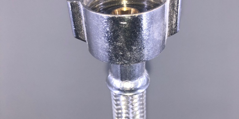 Image of a toilet supply line as cover photo for blog "Not All Parts Are Created Equal"